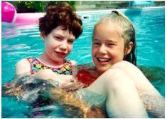Stacey and sister in the pool